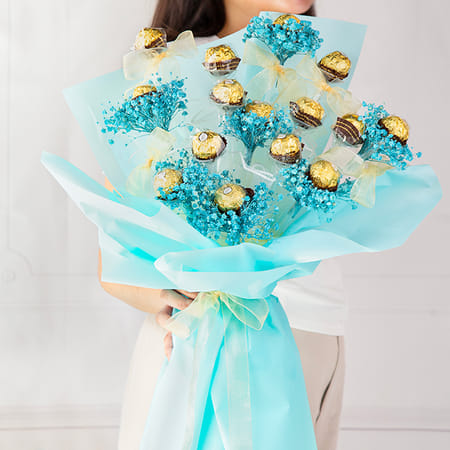Bouquet made of Ferrero Rocher chocolates and blue flowers