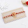 Buy Auspicious Pearl And Meena Work Ganesha Rakhi