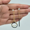 Buy Black and Golden Metallic Earring with Stone Studs