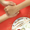 Buy CZ Ring Rakhis with Sandalwood Beads