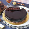 Buy Delicious Truffle Cake With Bunch Of White Roses