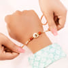 Gift Designer Mother of Pearl Om & Rudraksha Rakhi