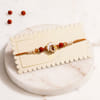 Shop Designer Mother of Pearl Om & Rudraksha Rakhi