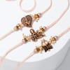 Buy Divine Antique Pearl Rakhi Set with Toblerone