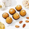 Shop Divine Lord Ganesha Rakhi with Besan Ladoo Hamper