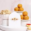Divine Lord Ganesha Rakhi with Besan Ladoo Hamper Online