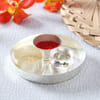 Buy Dry Fruits in Designer Potlis with Silver Plated Puja Thali