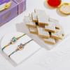 Elegant Peacock Rakhis And Kaju Katli Combo Online
