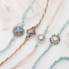 Gift Enthralling Blue Stone Rakhi Set Of 4