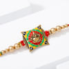 Gift Ganesha Rakhi with Meena Work & Golden beads