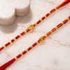Buy Gold Toned Swastika, Om & Ganesha Rakhi Set of 4