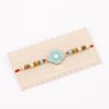 Shop IGP Antique Motif Silver Rakhi