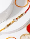 IGP Stone Rakhi with Golden Beads