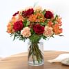 Mixed bouquet of warm orange and red tones