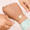 Buy Mother of Pearl Floral Charms Rakhi Set of 3