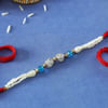 Pearl Rakhi with CZ Stones & Blue Beads Online