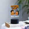 Buy Personalized Sibling Fighting Over Remote Acrylic Stand For Rakhi