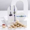 Royal Blue Rakhis And Sweets Combo Online