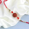 Gift Rudraksh Rakhi With Kaju Katli And Cashews In Potli