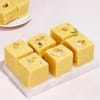 Shop Rudraksh & Swastik Om Rakhi with Sweets Hamper