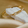 Shop Sparkling Golden Charms Bangle Bracelet