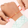 Gift Swastika and Om Gold Toned Rakhi Set of 2