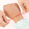 Buy Swastika and Om Gold Toned Rakhi Set of 2