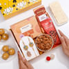Temple Design Rakhi With Scrumptious Goodies Hamper Online