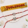 Traditional Ganesh and Floral Rakhi Set with Toblerone Online
