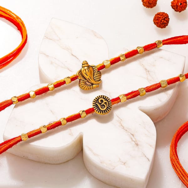 Om and Ganesha Gold Toned Rakhi Set of 2