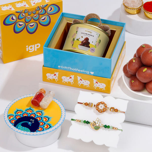 Peacock Kundan Rakhis And Gulab Jamun Hamper