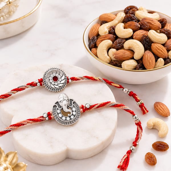 Silver-Plated Ganesh and Floral Rakhi Set with Dry Fruits