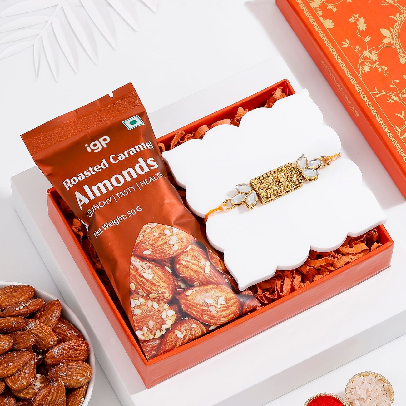 Antique Kundan Rakhi And Almonds Combo