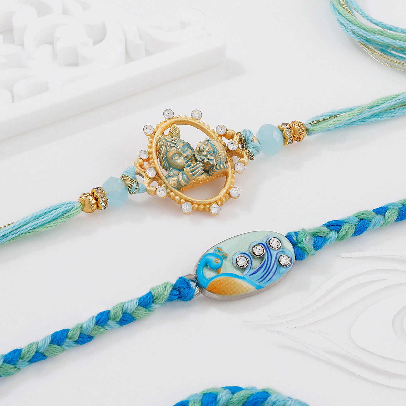 Bal Krishna And Peacock Pastel Meenakari Rakhis - Set Of 2