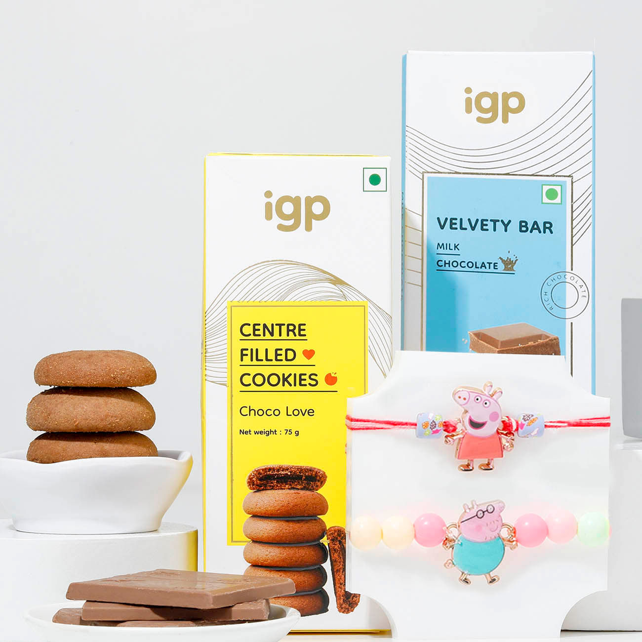 Cheerful Peppa Pig Rakhis And Chocolate Surprise Combo