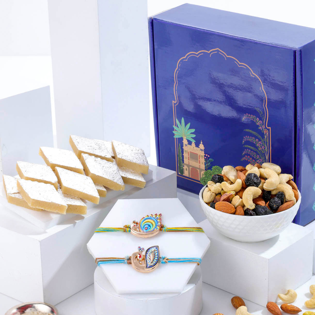 Colourful Peacock Rakhis With Delightful Treats