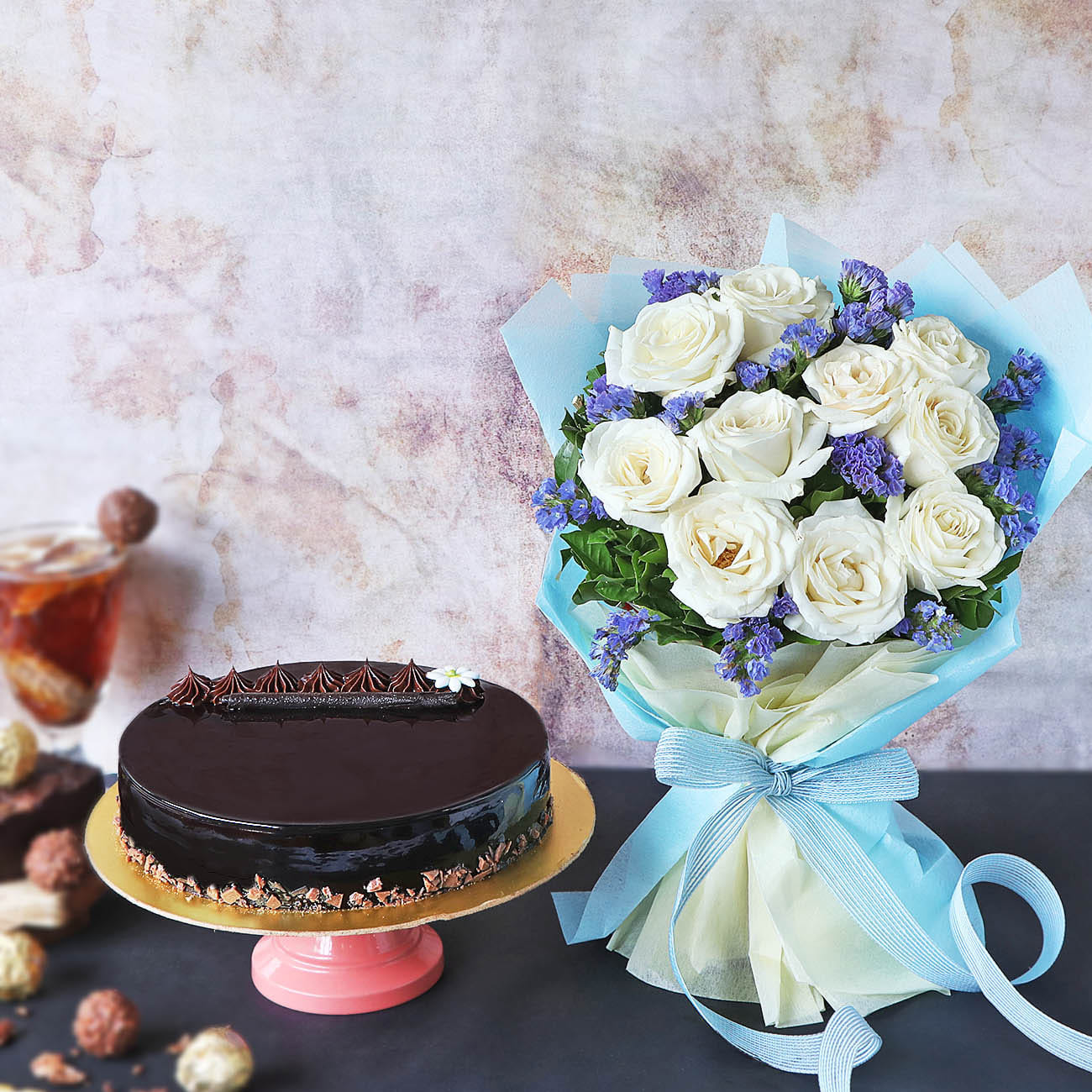 Delicious Truffle Cake With Bunch Of White Roses