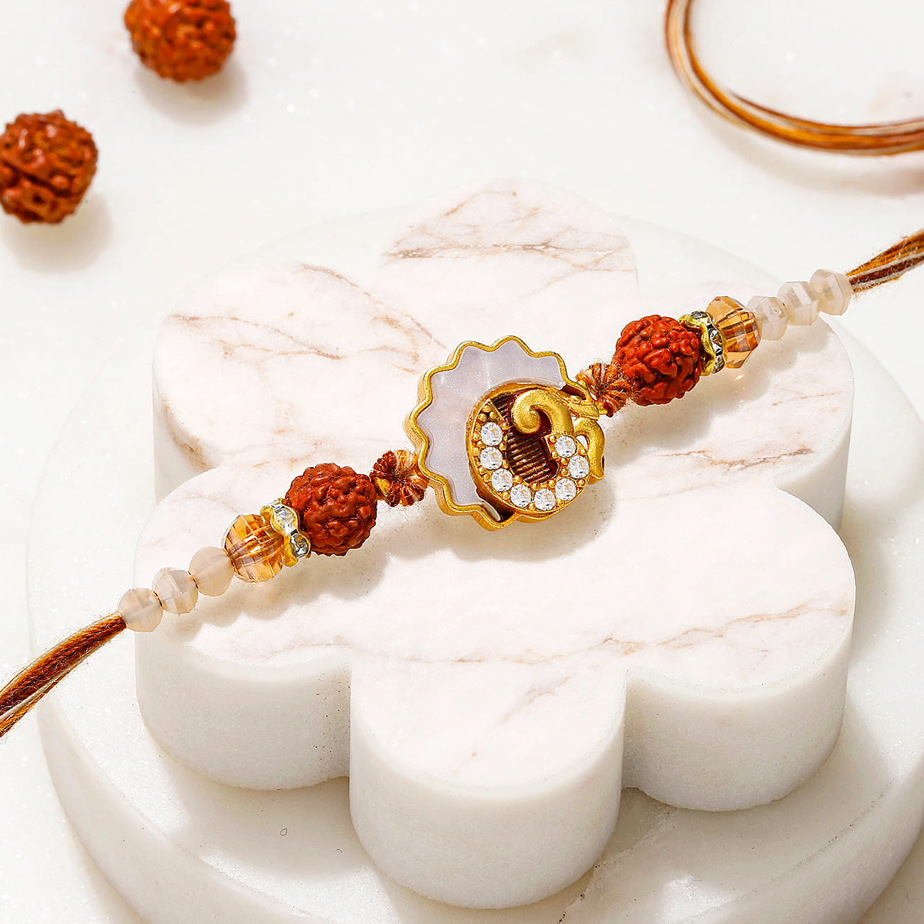 Designer Mother of Pearl Om & Rudraksha Rakhi