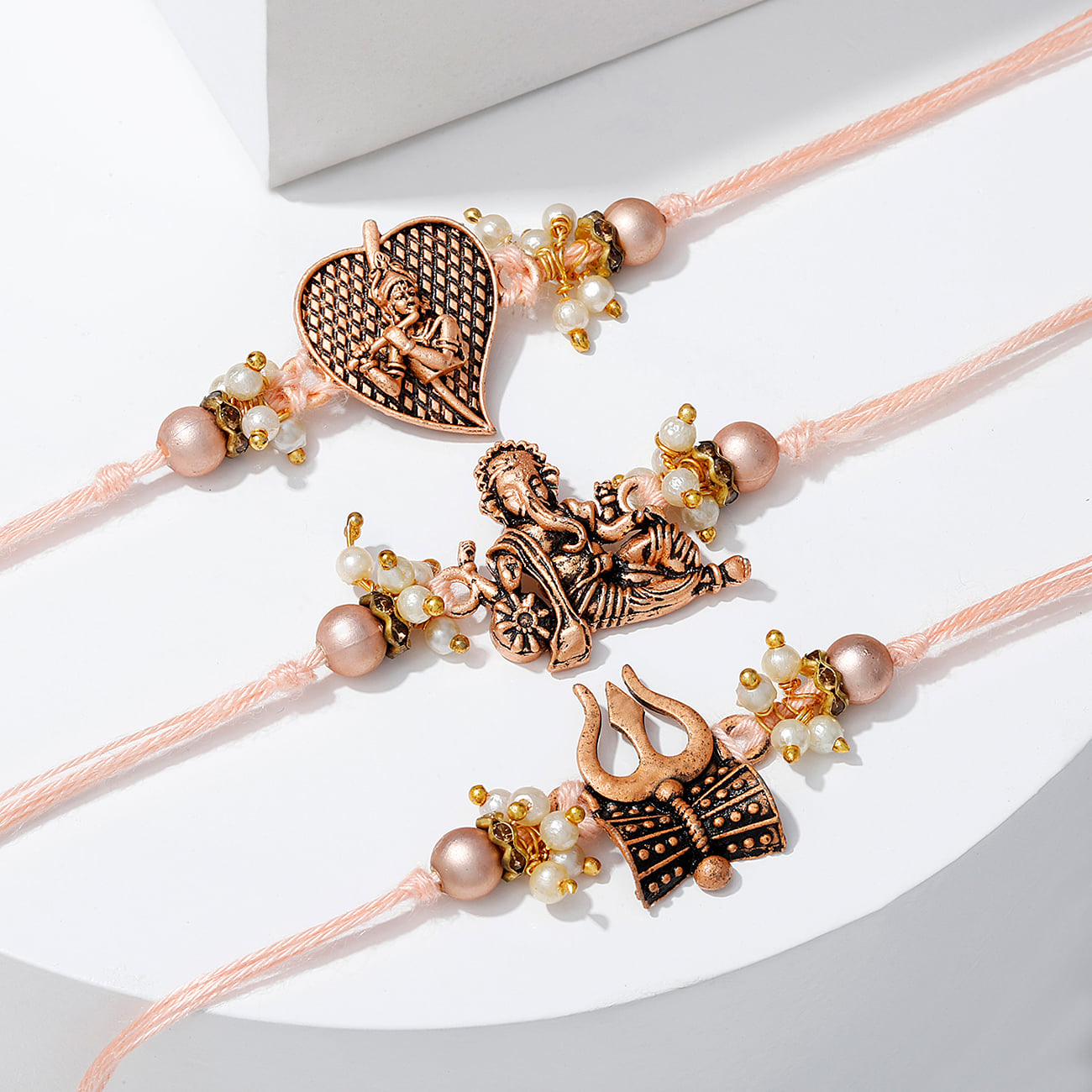 Divine Antique Pearl Rakhi (Set of 3)