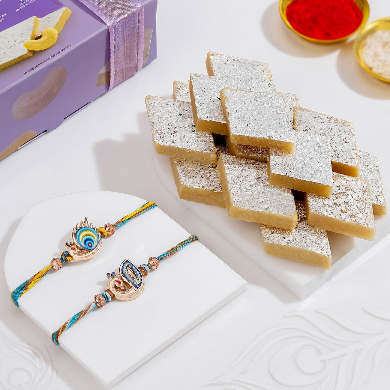 Elegant Peacock Rakhis And Kaju Katli Combo