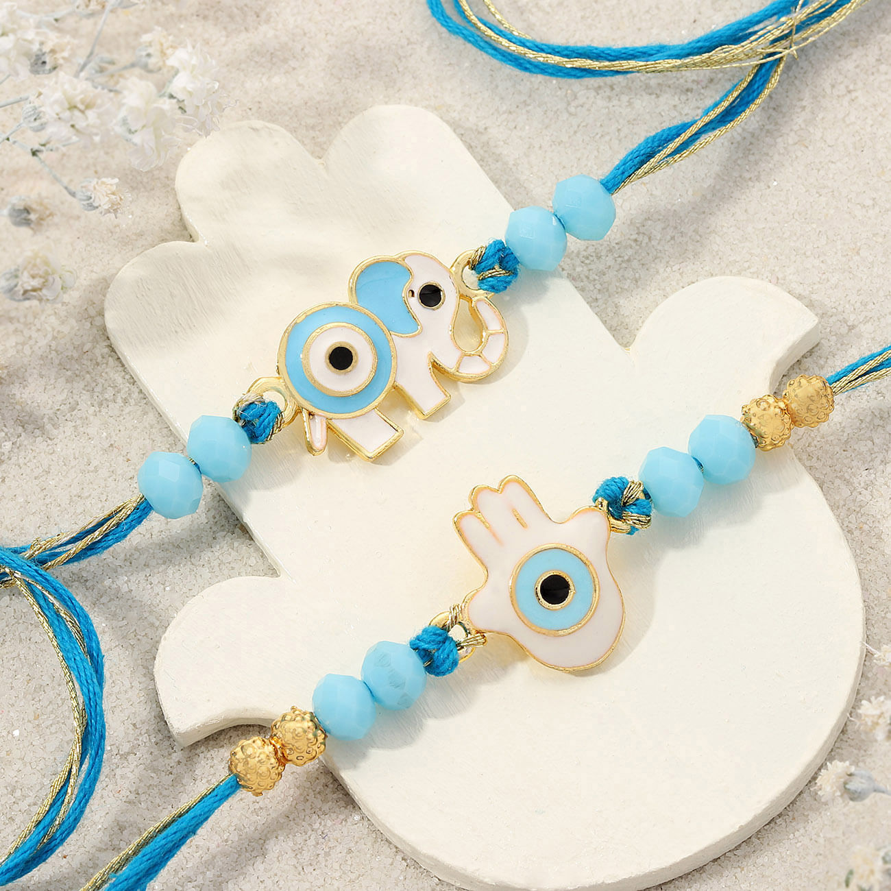 Evil Eye Elephant and Hamsa Rakhi Set Of 2