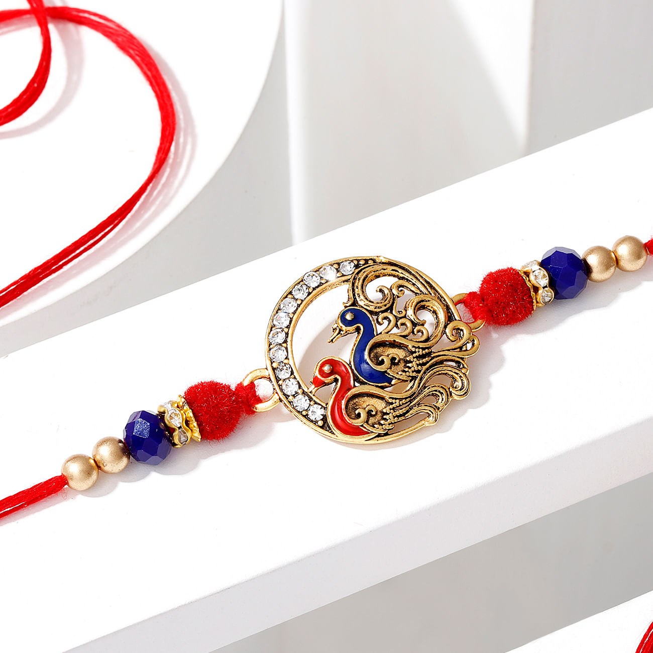 Golden Peacock Rakhi with Golden Bead