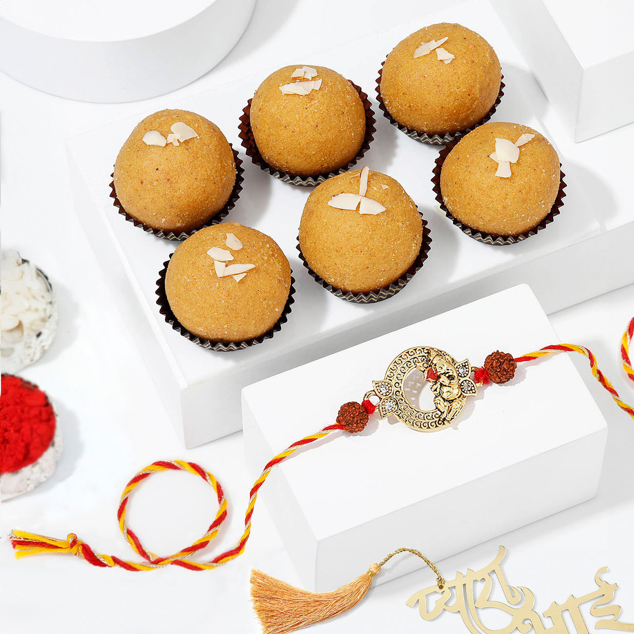 Lord Ganesha CZ Stones Rakhi And Besan Laddoo Combo