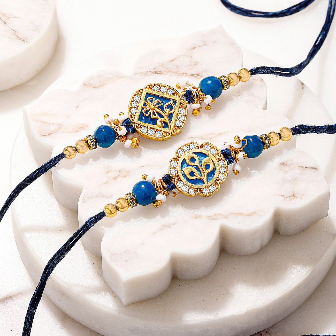 Mother of Pearl Blue Floral Rakhi Set of 2