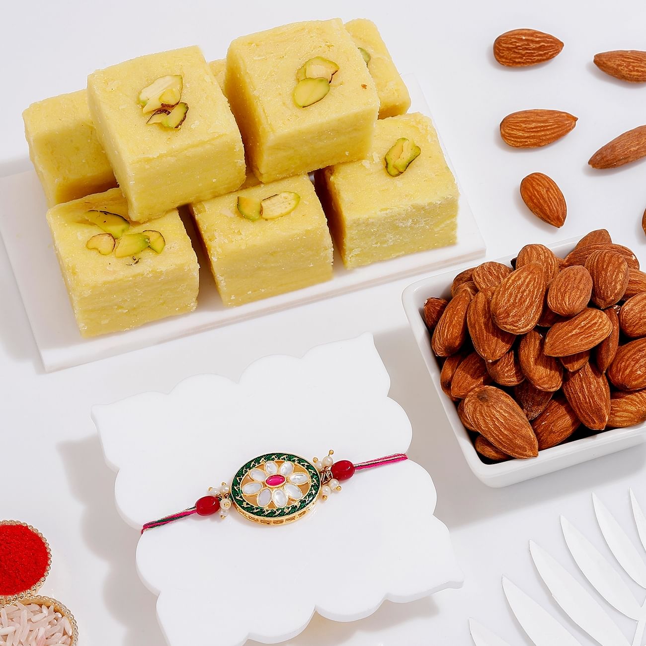 Oval Kundan Rakhi With Soan Papdi And Almonds