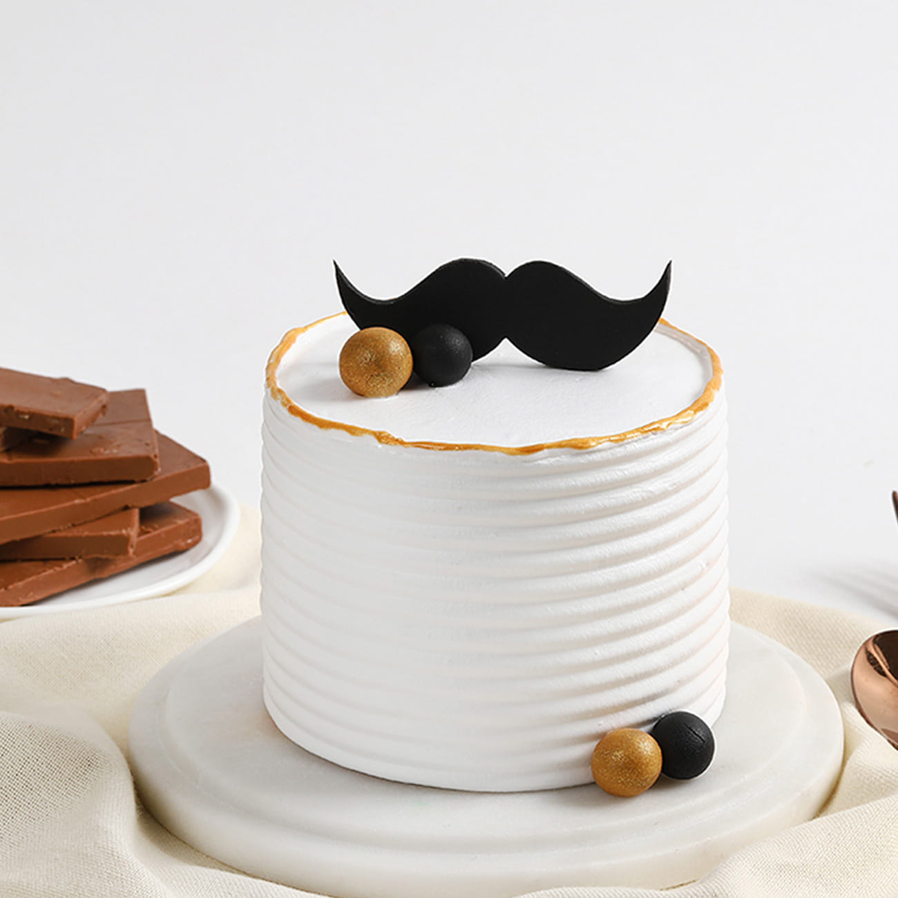 Pearly Moustache Cake