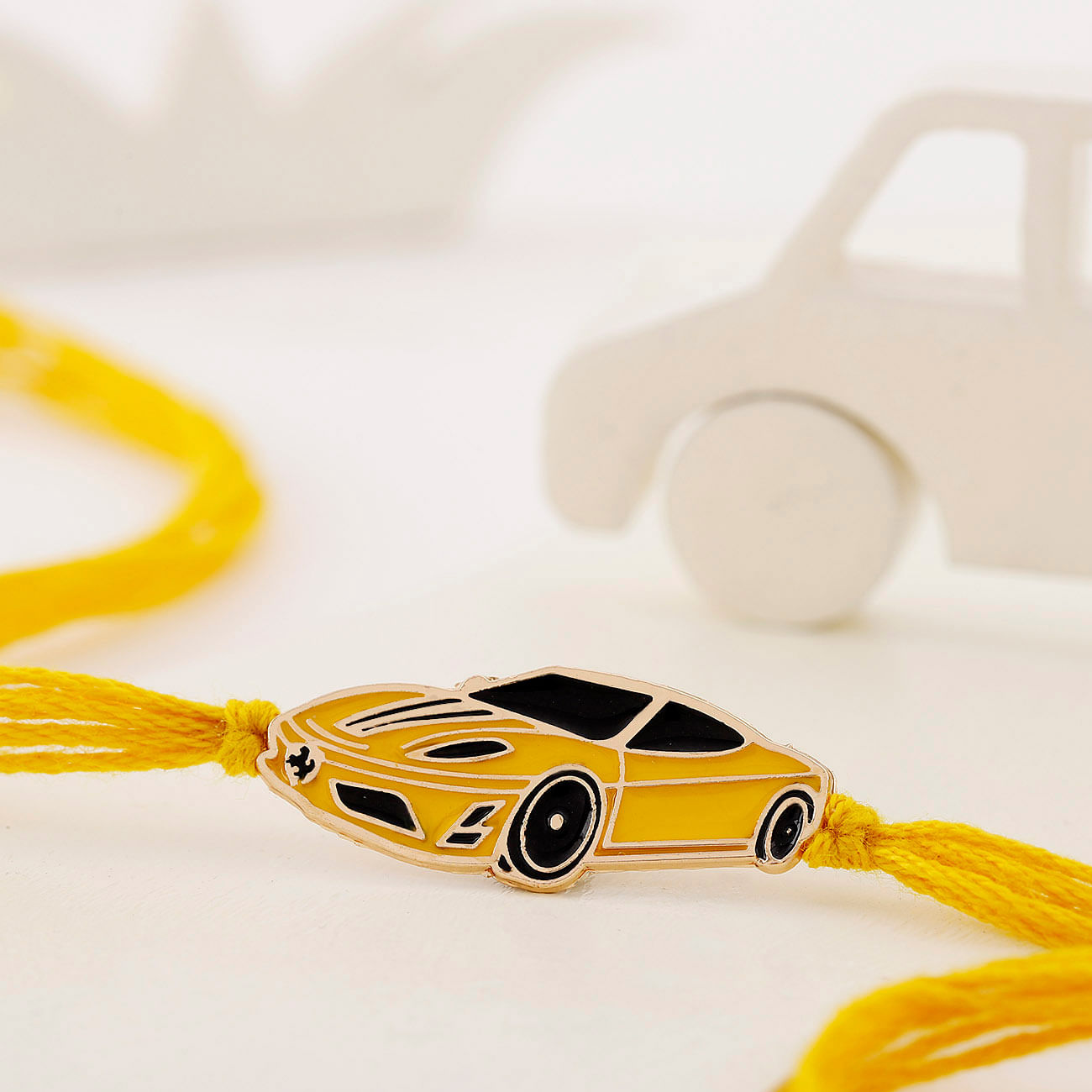 Striking Ferrari Car Rakhi For Kids